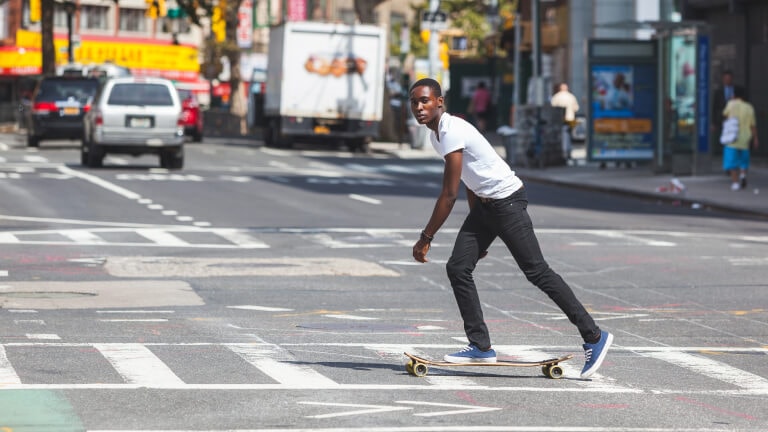 skateboarding on a busy street